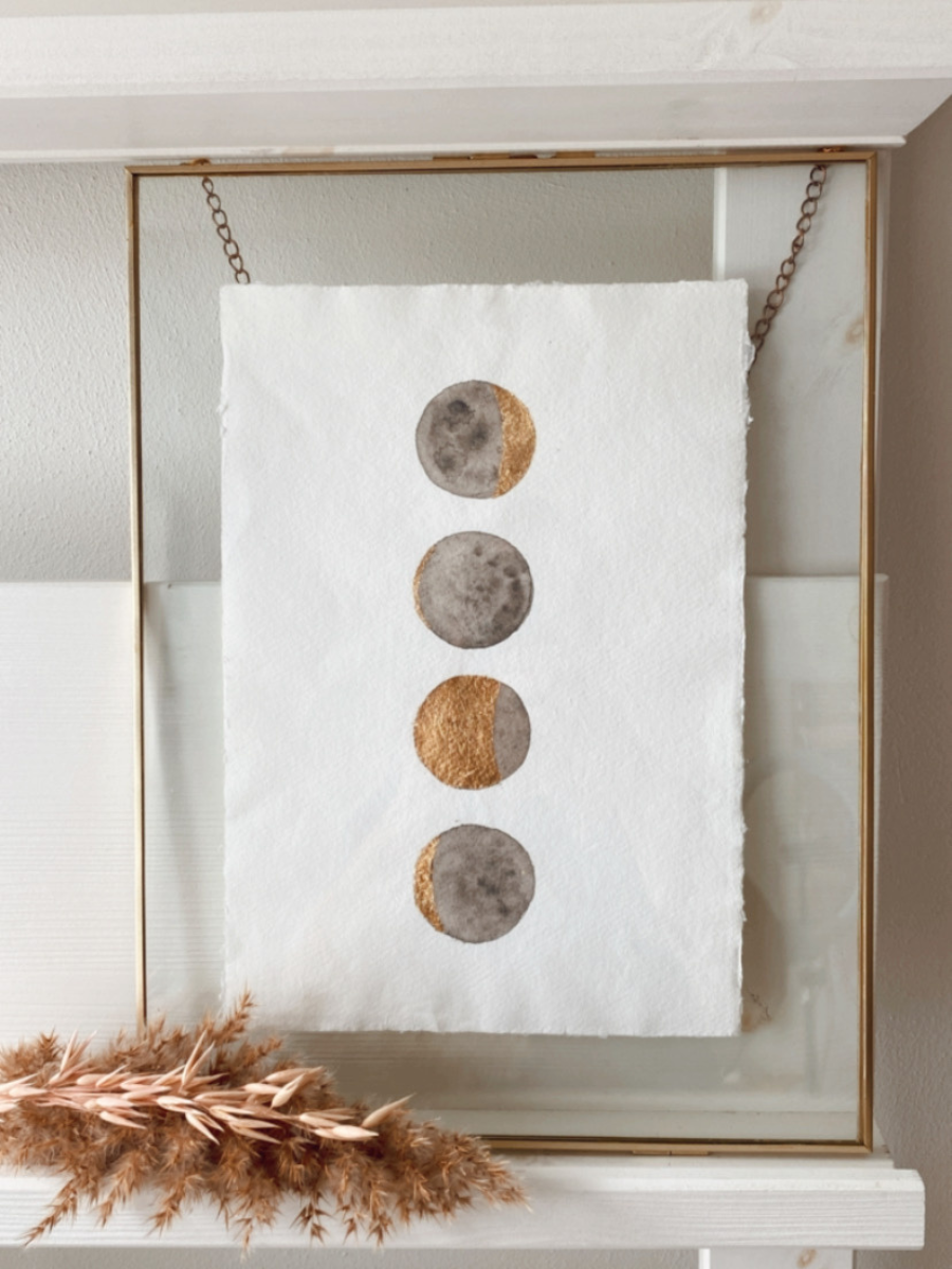 familie maanportret in gouden lijst